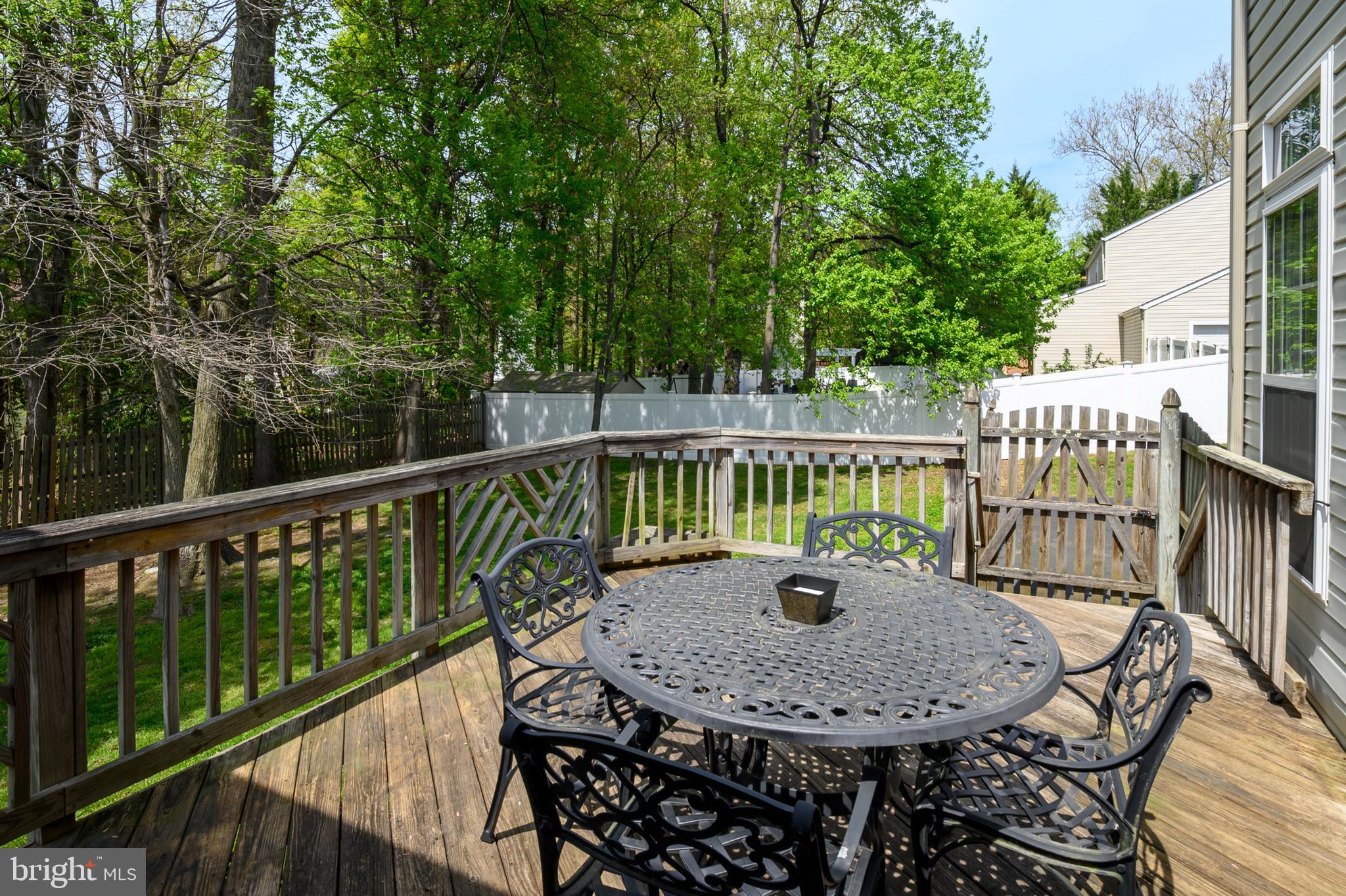 456 North Patuxent Road Odenton, MD 21113 - Photo 35 of 44 a view of a balcony with a table and chairs