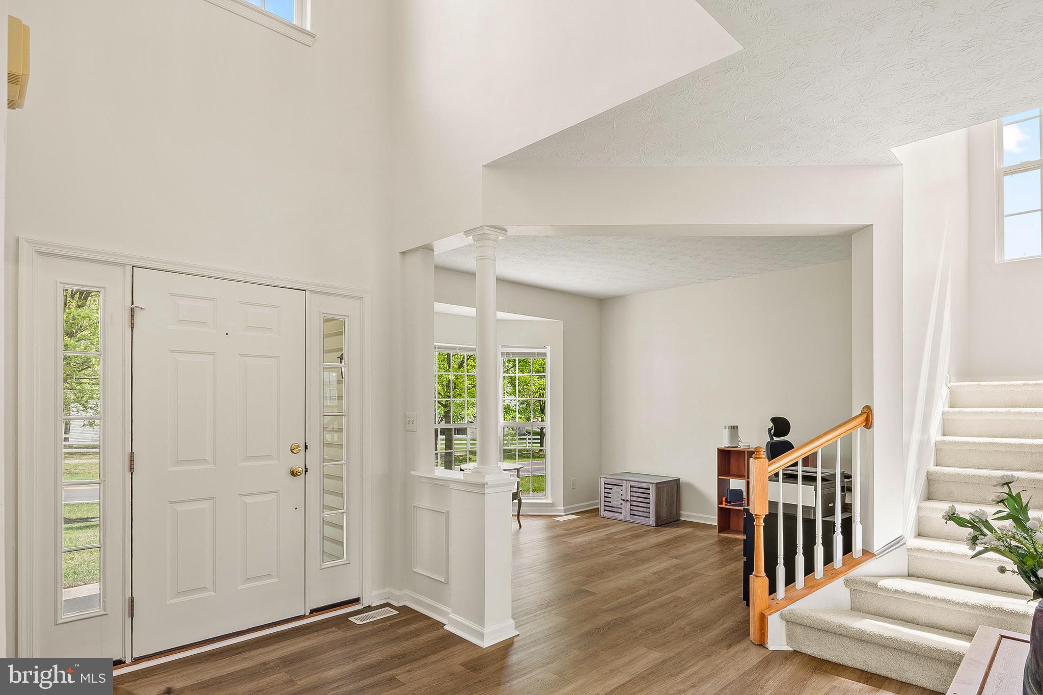 456 North Patuxent Road Odenton, MD 21113 - Photo 4 of 44 a view of a livingroom with wooden floor and windows