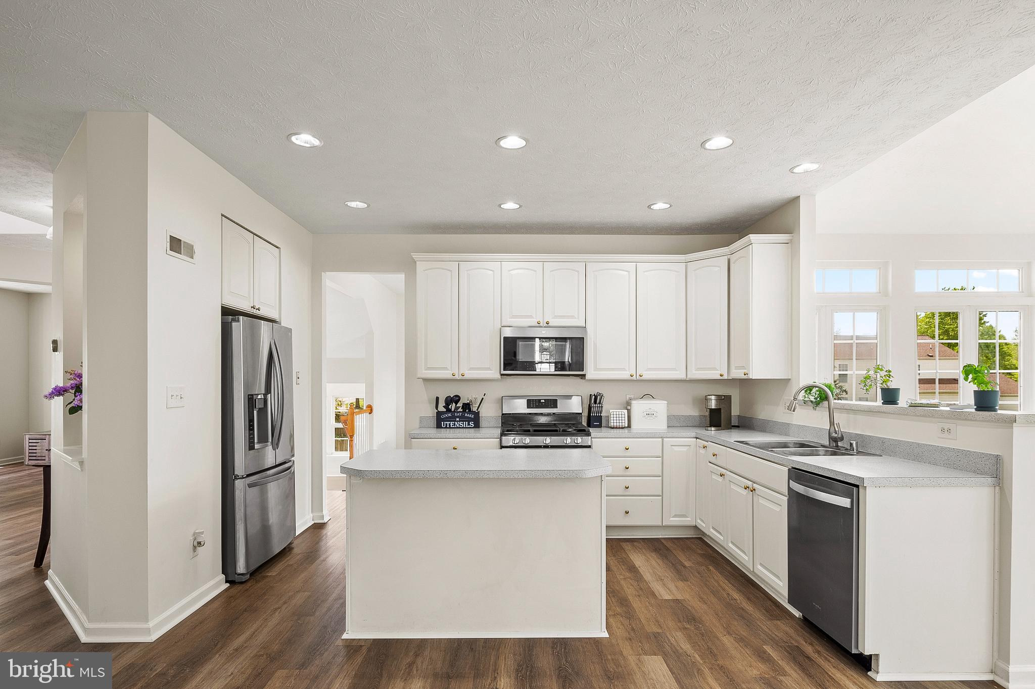 456 North Patuxent Road Odenton, MD 21113 - Photo 10 of 44 a kitchen with white cabinets and stainless steel appliances