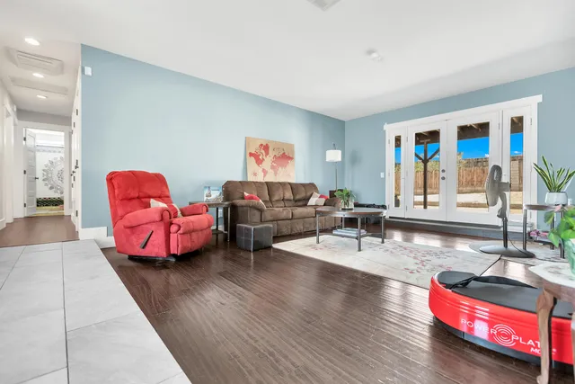 a living room with furniture window and a flat screen tv