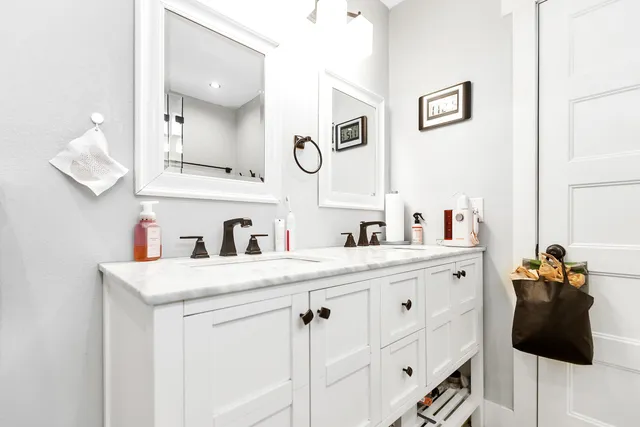 a utility room with sink dryer and washer