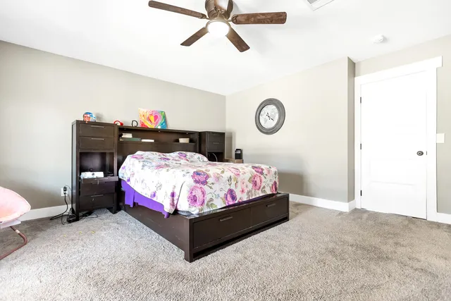 a bed room with a bed and a window