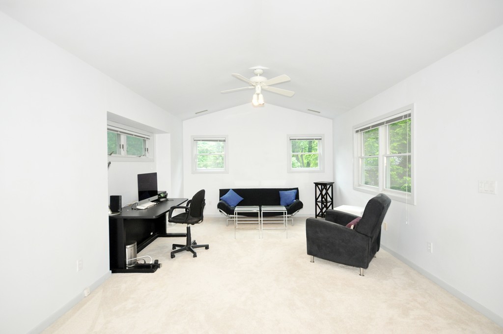 138 Tower Road Lincoln, MA 01773 - Photo 14 of 23 a living room with furniture and a large window