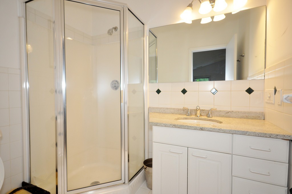 138 Tower Road Lincoln, MA 01773 - Photo 15 of 23 a bathroom with a granite countertop sink and a mirror