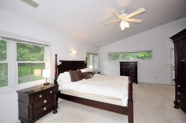 138 Tower Road Lincoln, MA 01773 - Photo 16 of 23 a bedroom with a bed a window and a flat screen television