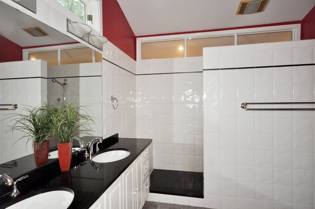 138 Tower Road Lincoln, MA 01773 - Photo 17 of 23 a bathroom with a sink vanity granite and shower