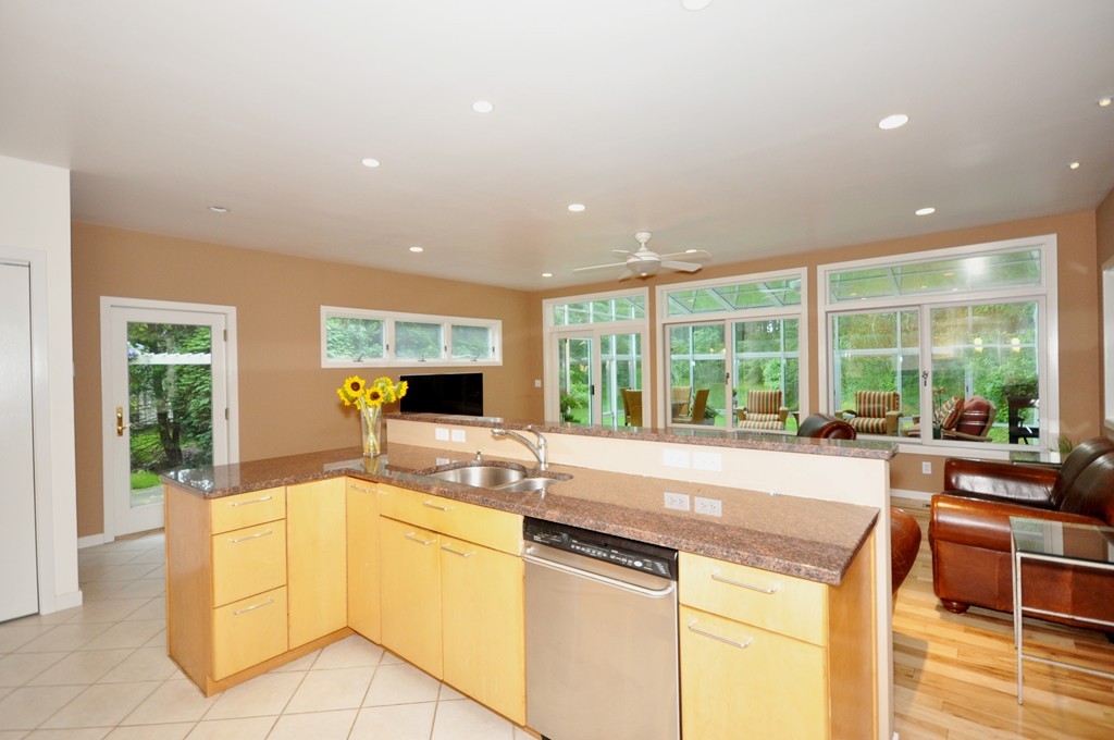 138 Tower Road Lincoln, MA 01773 - Photo 4 of 23 a large white kitchen with a large window