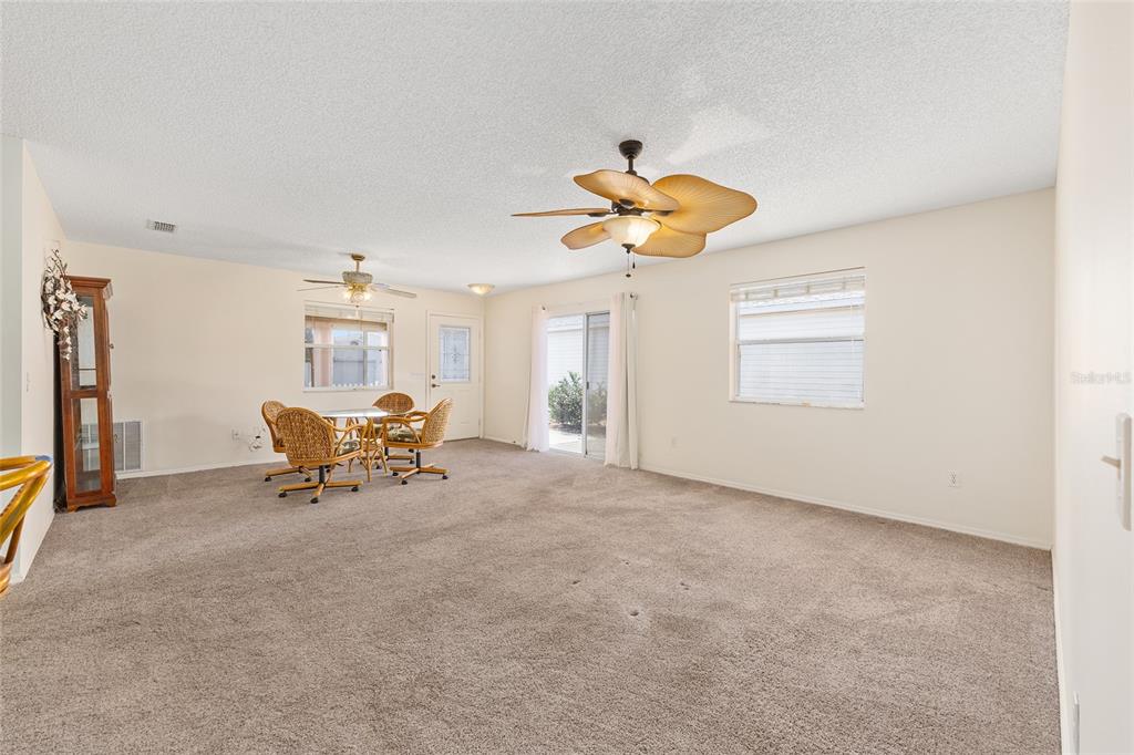 1710 Rosales Road The Villages, FL 32162 - Photo 7 of 23 a view of livingroom with furniture and a window