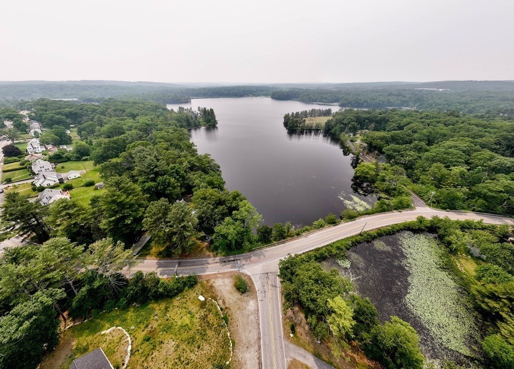 462 Goldthwaite Road Northbridge, MA 01588 - Photo 13 of 40 a view of a lake with a yard and large trees