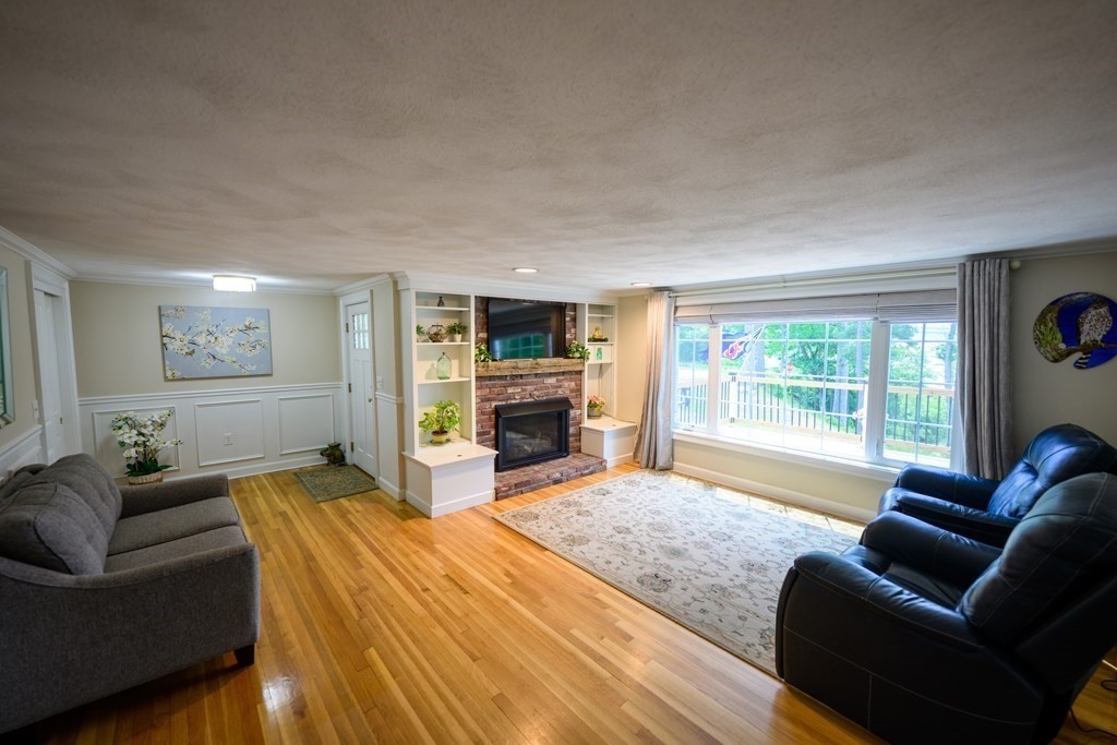 462 Goldthwaite Road Northbridge, MA 01588 - Photo 15 of 40 a living room with furniture and a fireplace
