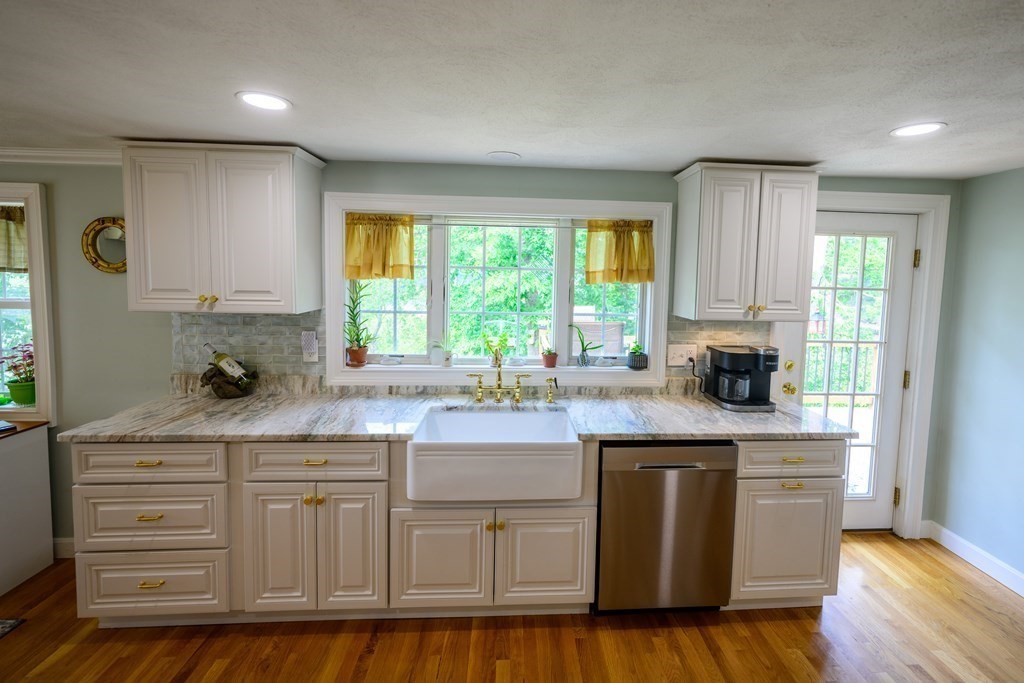 462 Goldthwaite Road Northbridge, MA 01588 - Photo 19 of 40 a kitchen with white cabinets and window