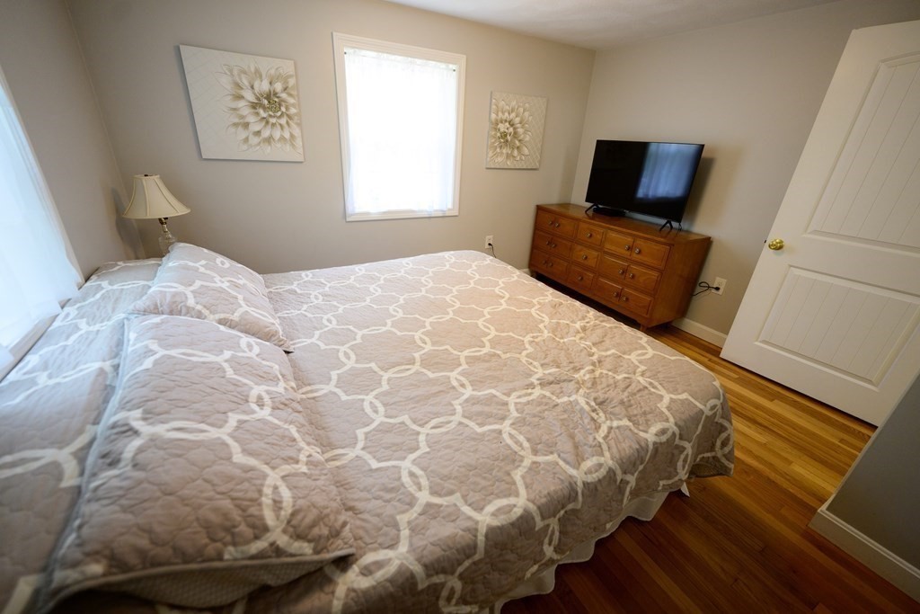 462 Goldthwaite Road Northbridge, MA 01588 - Photo 25 of 40 a bedroom with a bed and flat screen tv