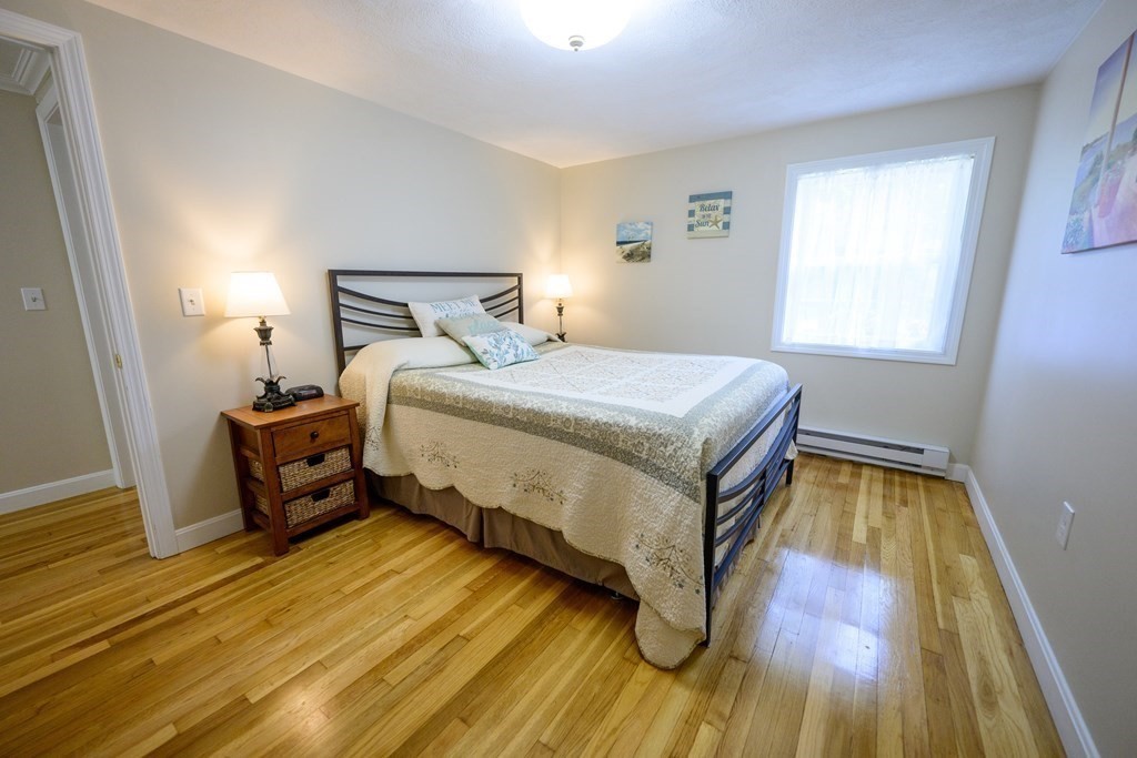 462 Goldthwaite Road Northbridge, MA 01588 - Photo 27 of 40 a bedroom with a bed and wooden floor