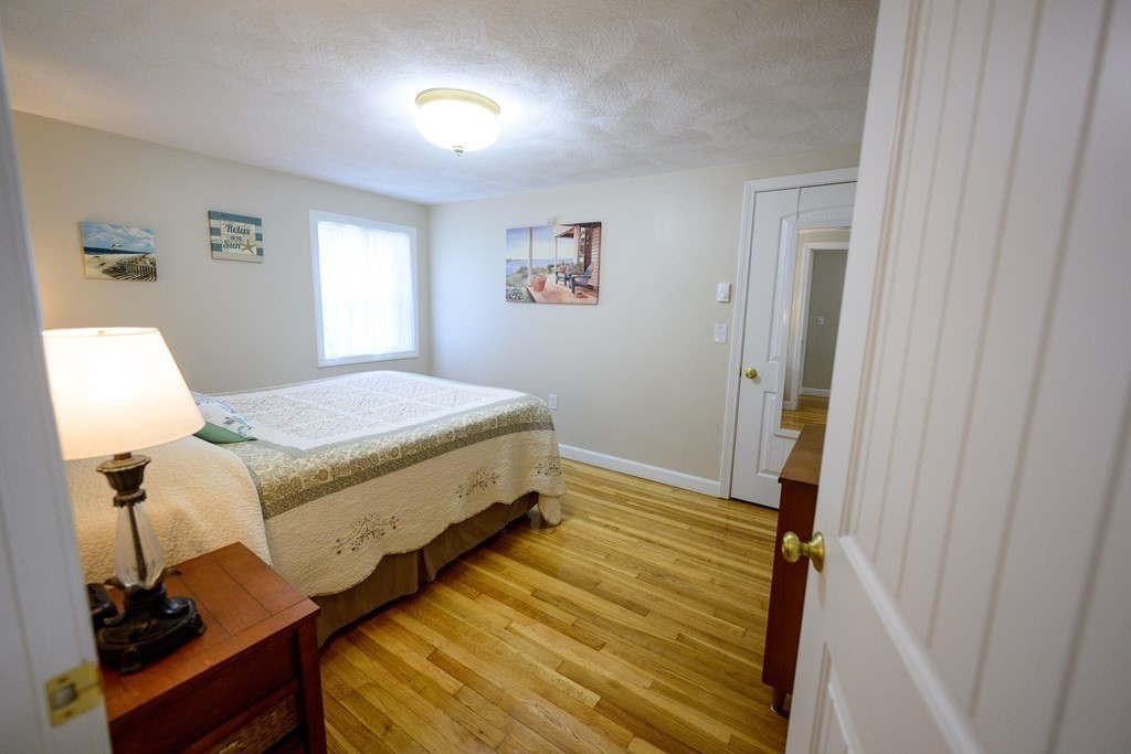 462 Goldthwaite Road Northbridge, MA 01588 - Photo 28 of 40 a bedroom with a bed and wooden floor
