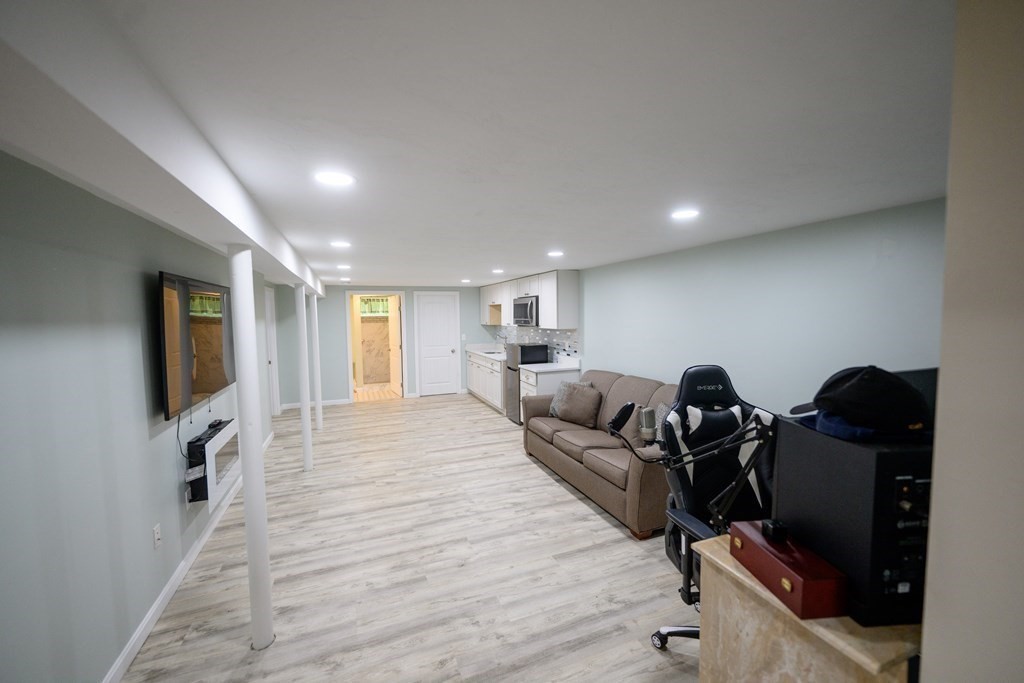 462 Goldthwaite Road Northbridge, MA 01588 - Photo 32 of 40 a living room with furniture flat screen tv and window