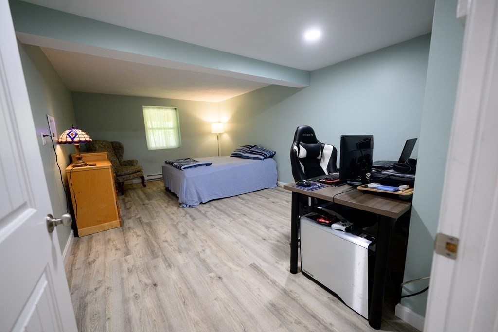 462 Goldthwaite Road Northbridge, MA 01588 - Photo 37 of 40 a living room with furniture and a wooden floor