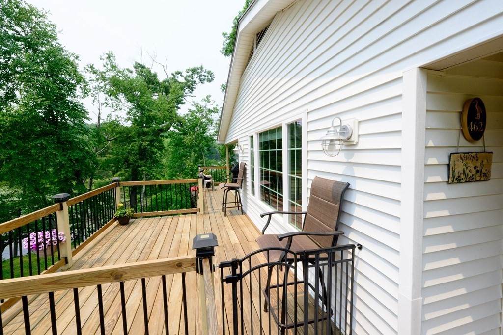 462 Goldthwaite Road Northbridge, MA 01588 - Photo 7 of 40 a view of a chair and tables in the balcony