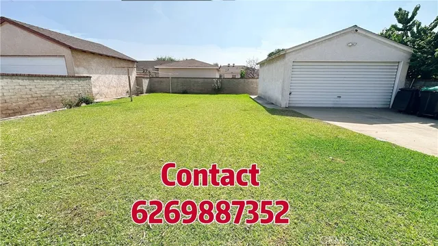 a sign that is sitting in front of a house