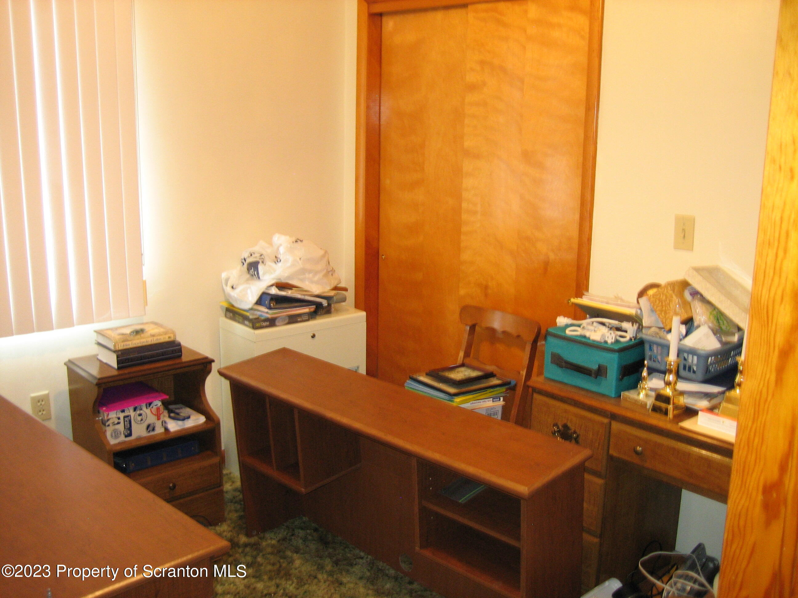 711 3rd Street Eynon, PA 18403 - Photo 13 of 29 a room with furniture and a window