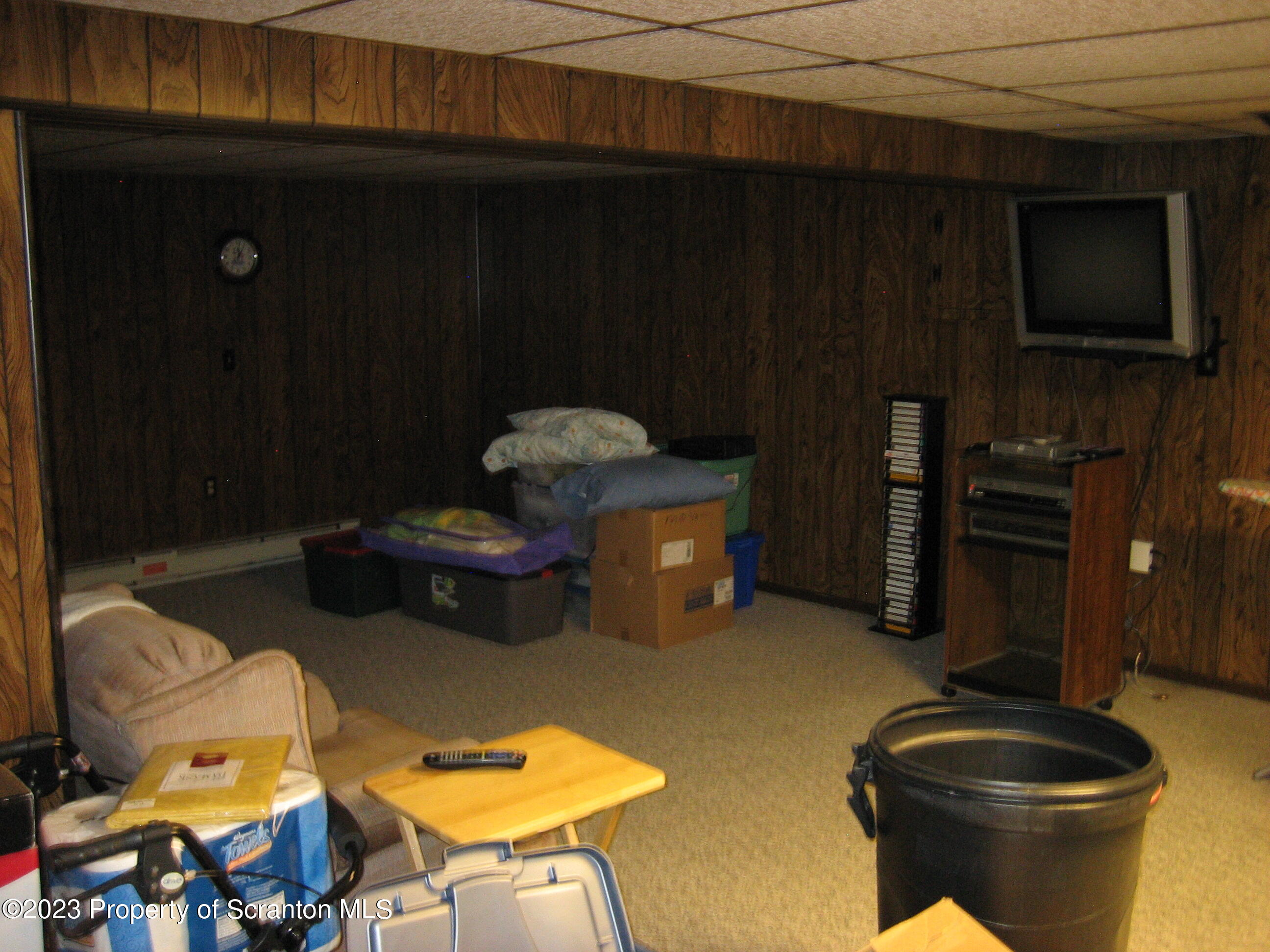 711 3rd Street Eynon, PA 18403 - Photo 16 of 29 a living room with furniture and a flat screen tv