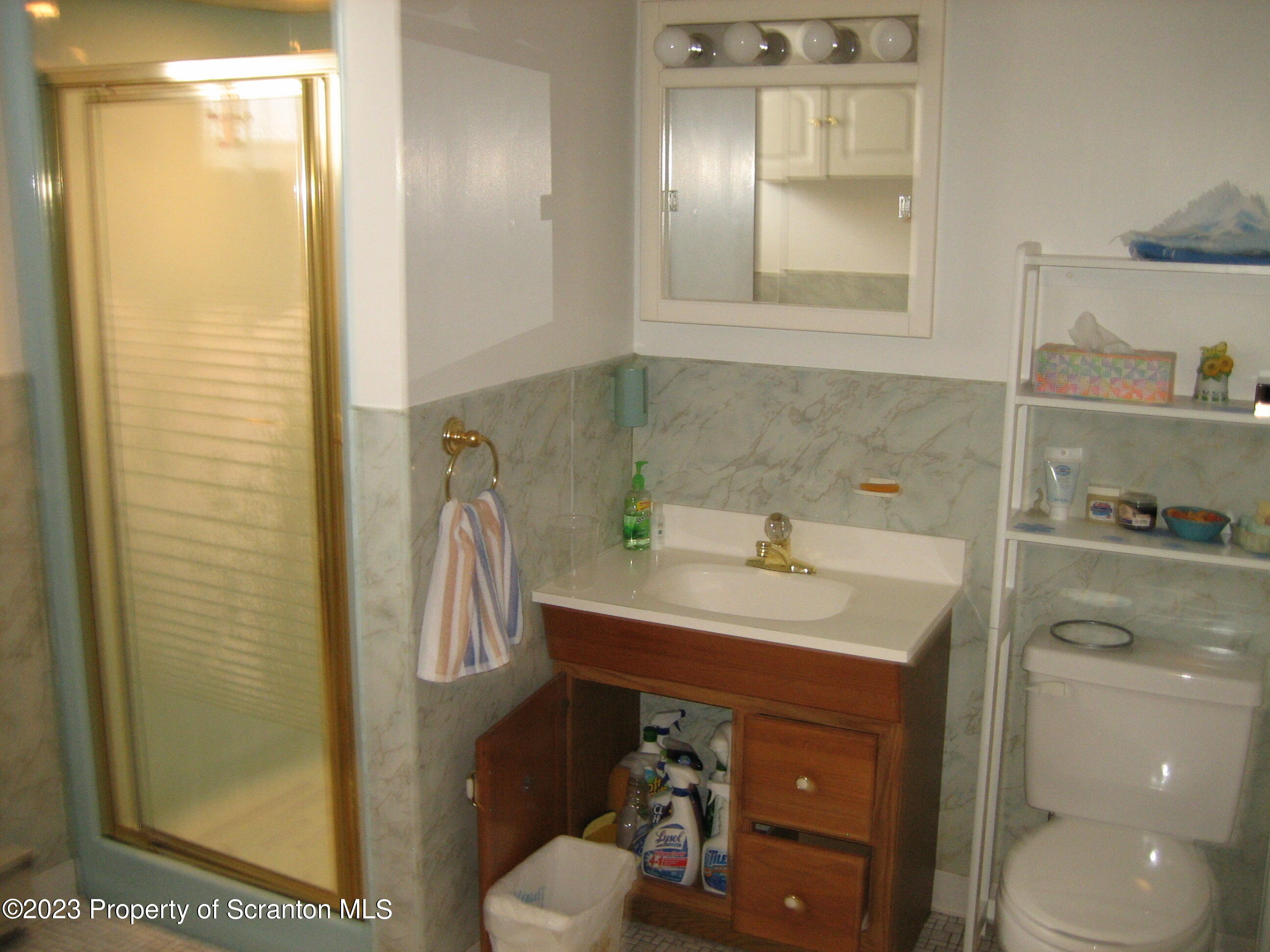 711 3rd Street Eynon, PA 18403 - Photo 19 of 29 a bathroom with a sink a toilet and shower