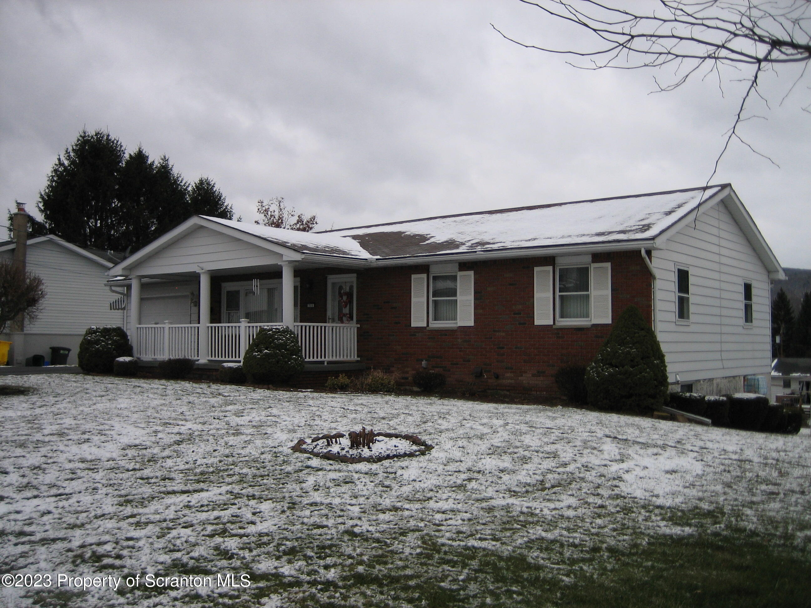 711 3rd Street Eynon, PA 18403 - Photo 2 of 29 a front view of a house with a yard