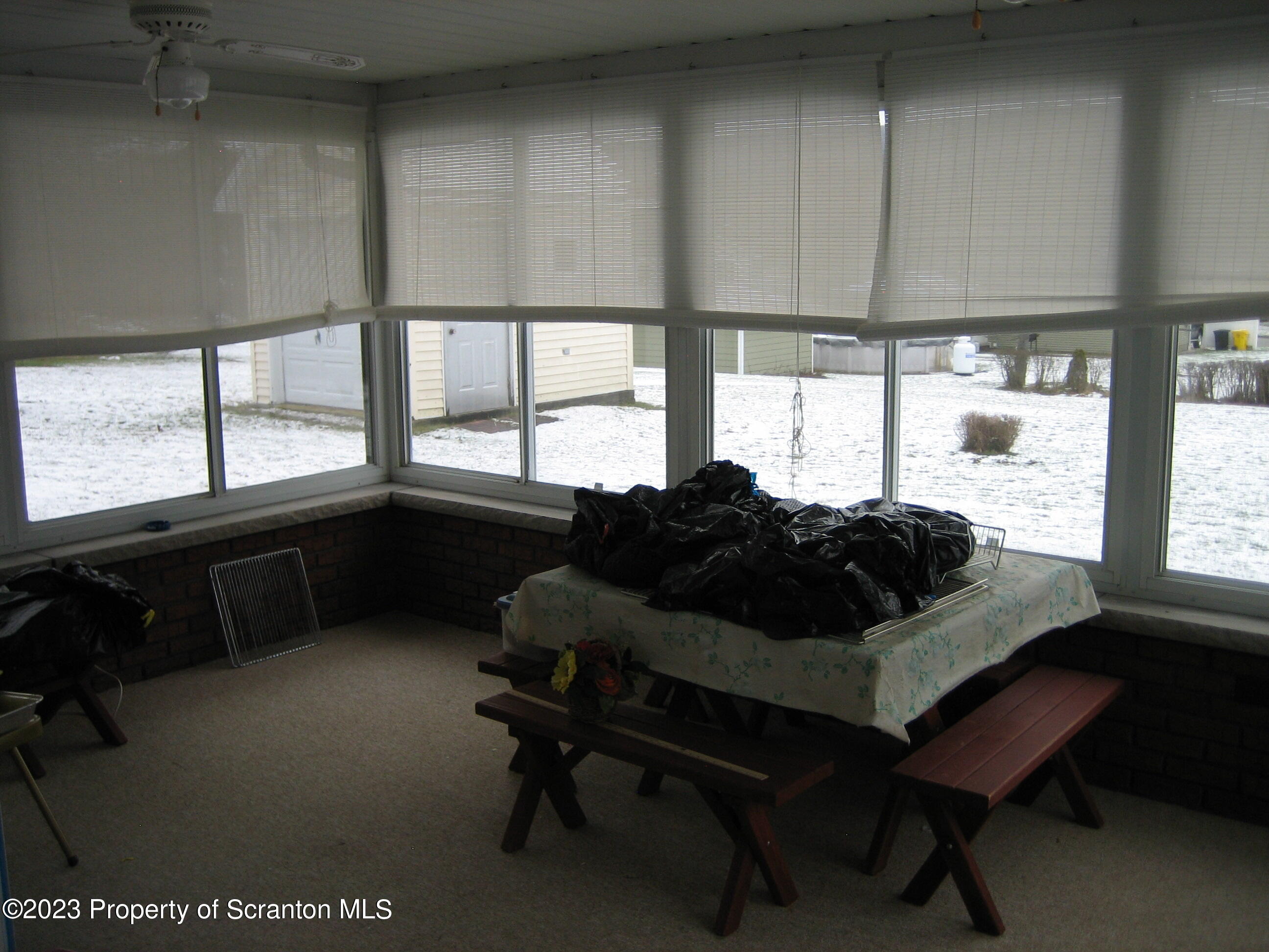 711 3rd Street Eynon, PA 18403 - Photo 21 of 29 a living room with furniture and a large window