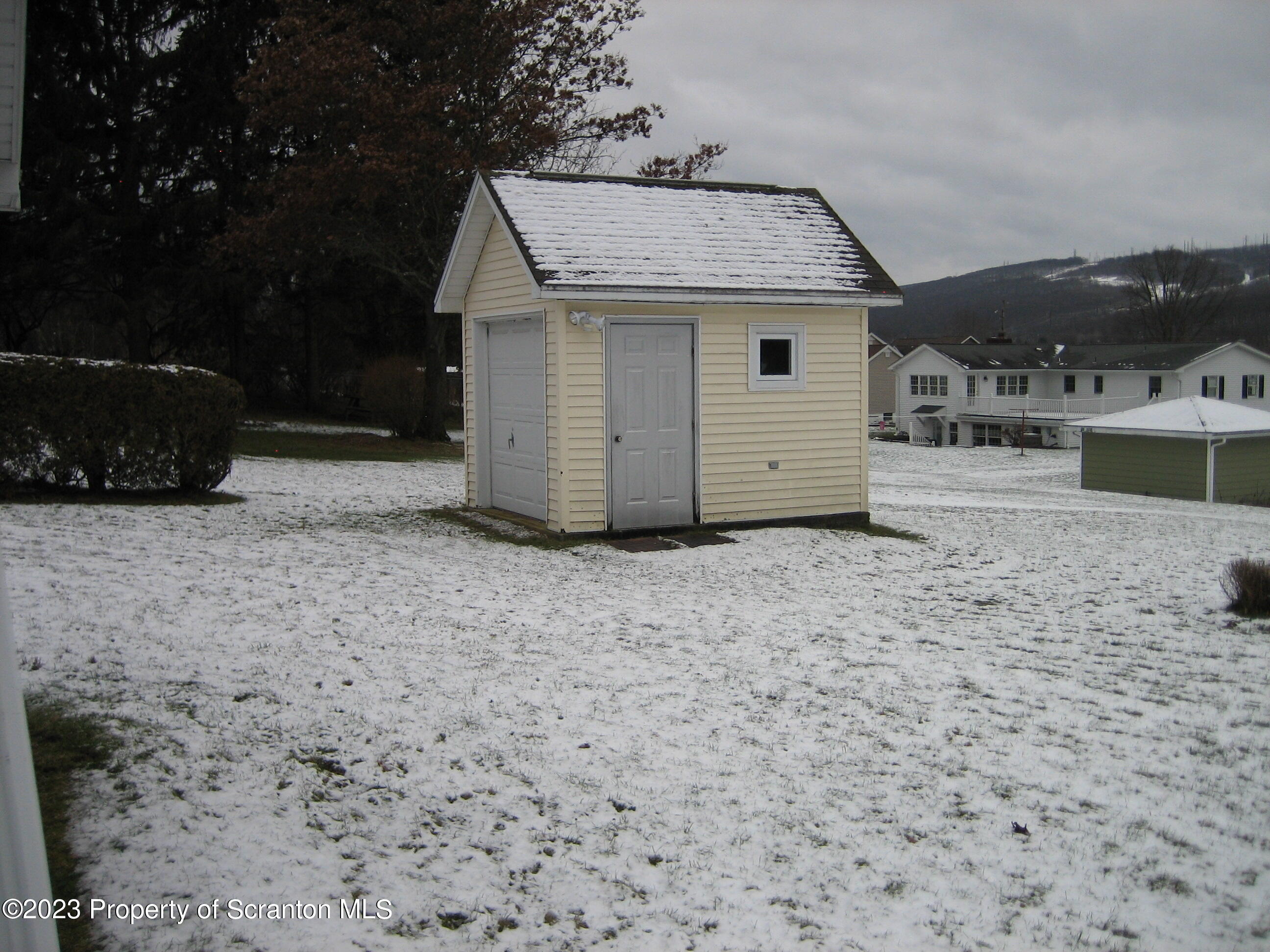 711 3rd Street Eynon, PA 18403 - Photo 23 of 29 a view of a house with a yard