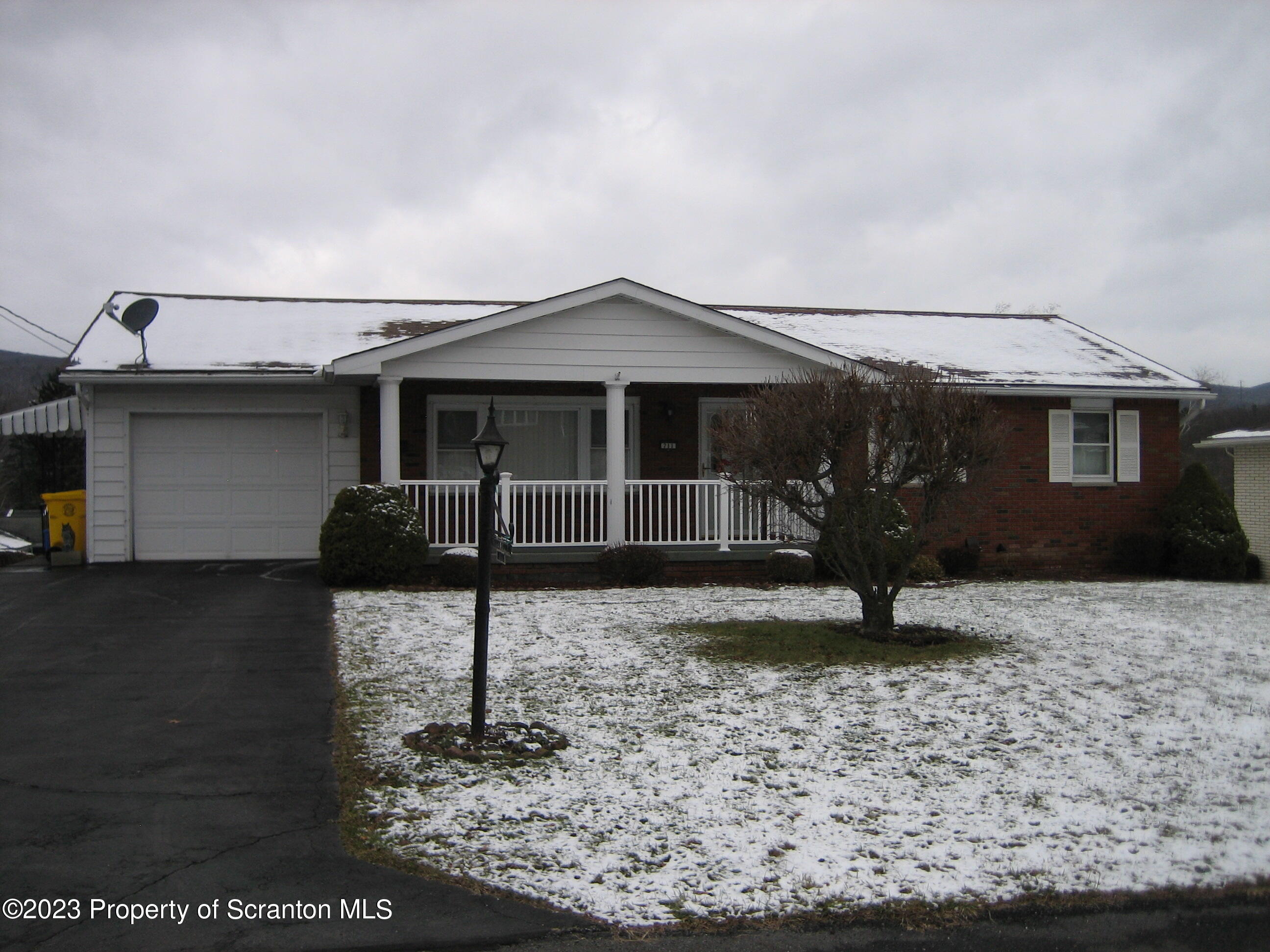 711 3rd Street Eynon, PA 18403 - Photo 26 of 29 a front view of a house with garden