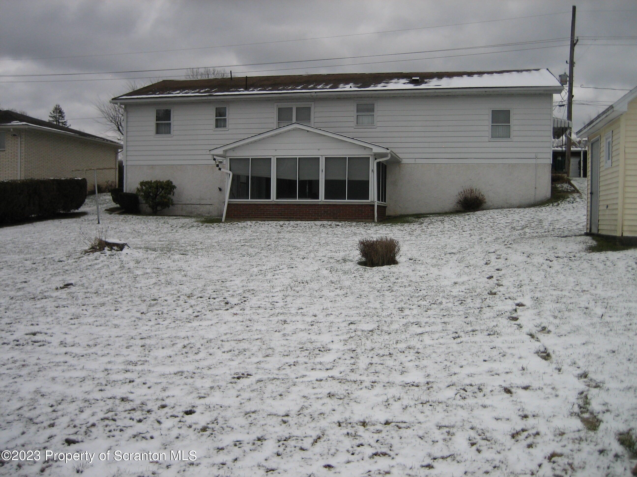 711 3rd Street Eynon, PA 18403 - Photo 28 of 29 a front view of a house with a yard