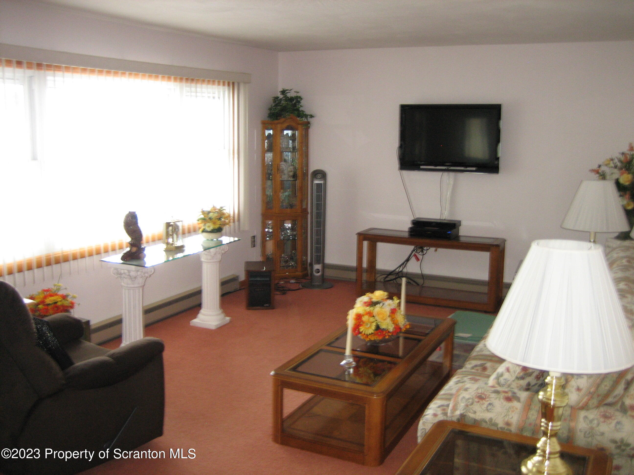 711 3rd Street Eynon, PA 18403 - Photo 6 of 29 a living room with furniture and a flat screen tv