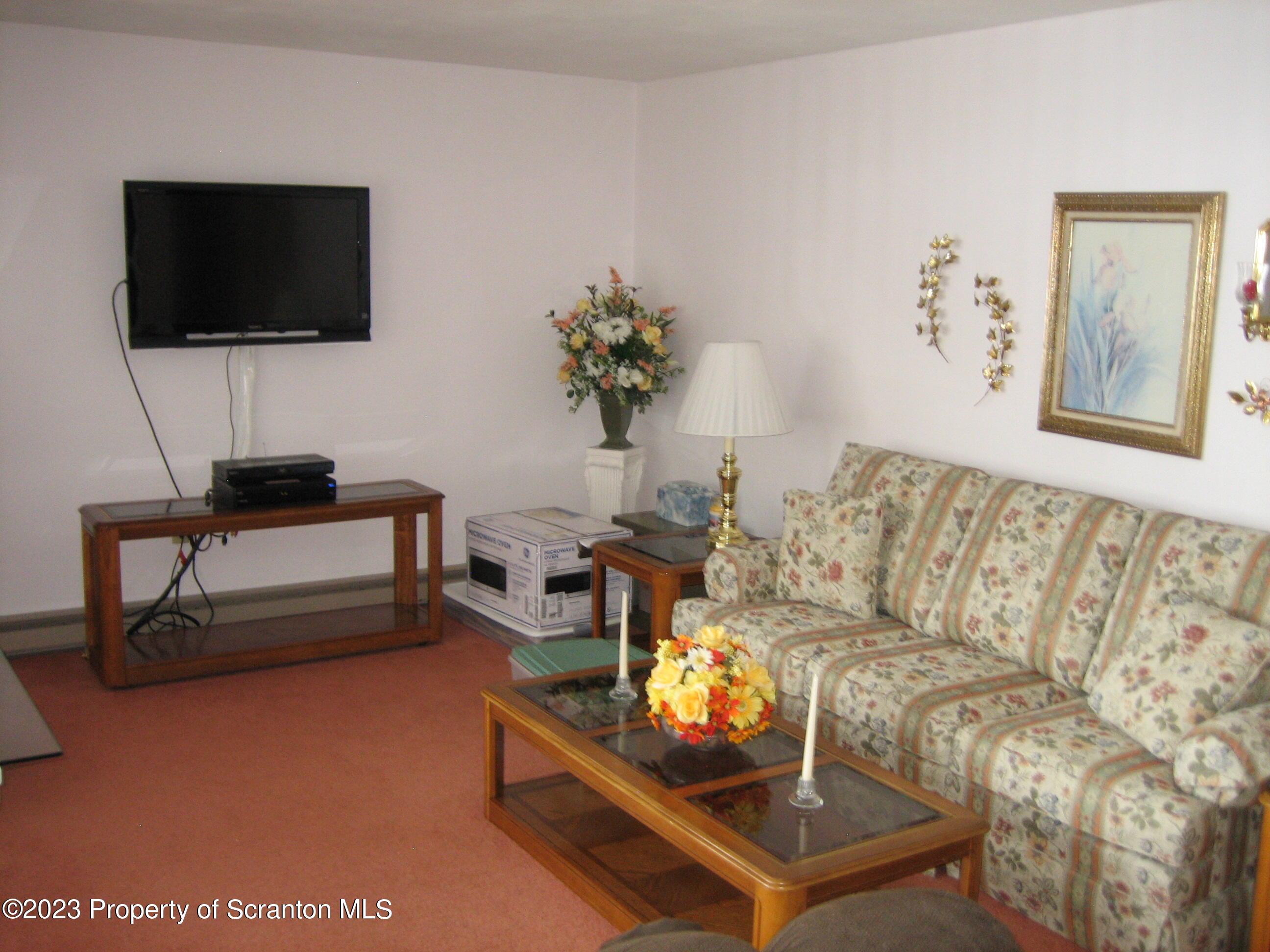 711 3rd Street Eynon, PA 18403 - Photo 7 of 29 a living room with furniture and a flat screen tv