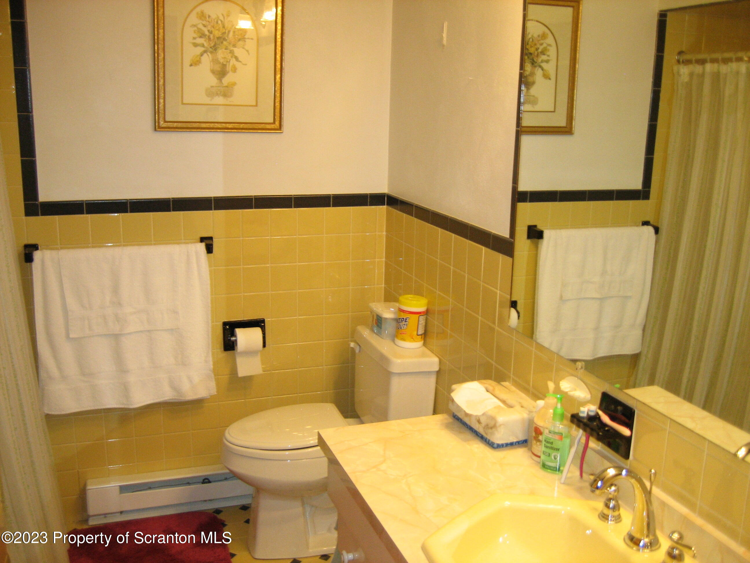 711 3rd Street Eynon, PA 18403 - Photo 8 of 29 a bathroom with a sink and toilet