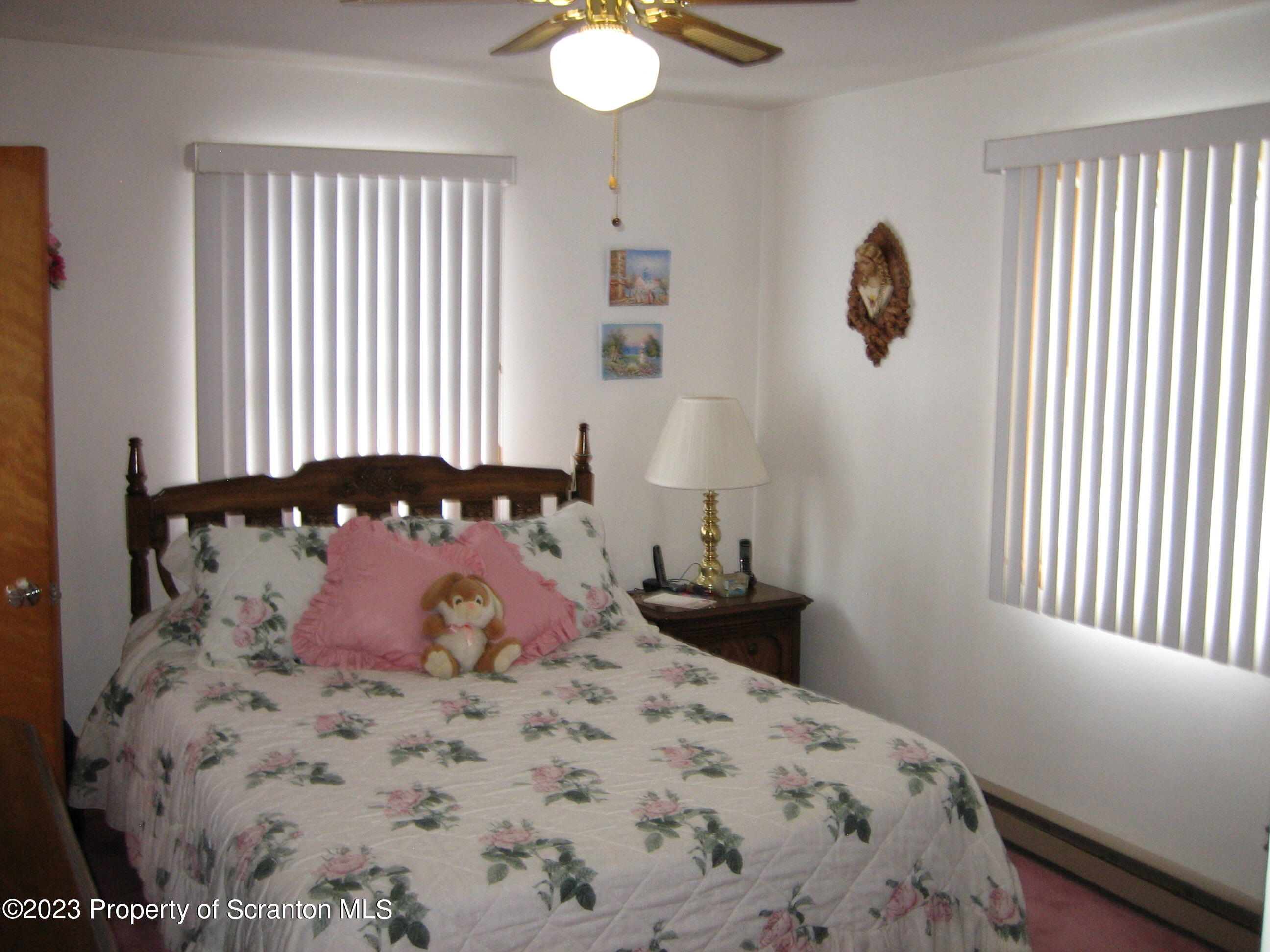 711 3rd Street Eynon, PA 18403 - Photo 10 of 29 a bedroom with a bed and a window