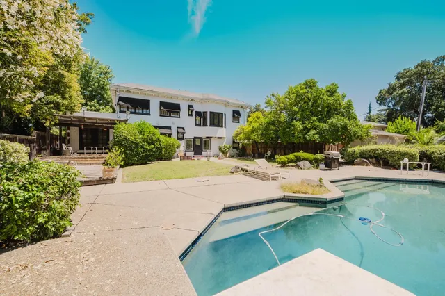 a view of a dining room with furniture and a livingroom