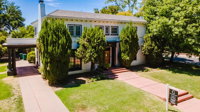 an aerial view of houses with yard