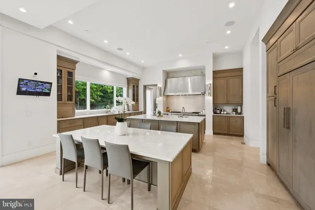 a kitchen with a sink a stove and cabinets