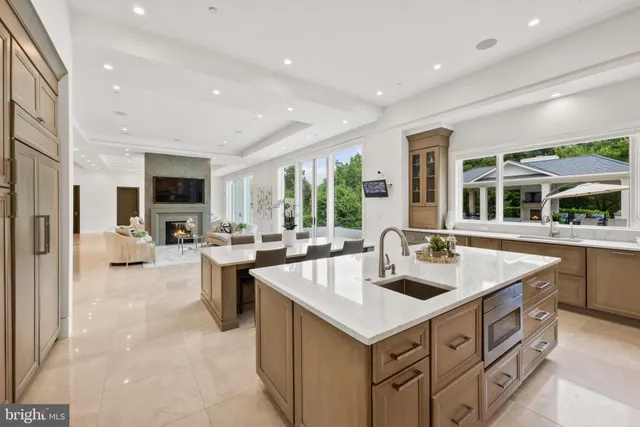 a spacious bedroom with a bed and a large window