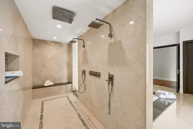 a view of a house with a big yard and palm trees