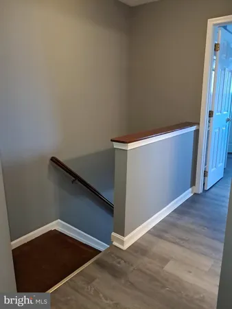 a view of entryway with wooden floor