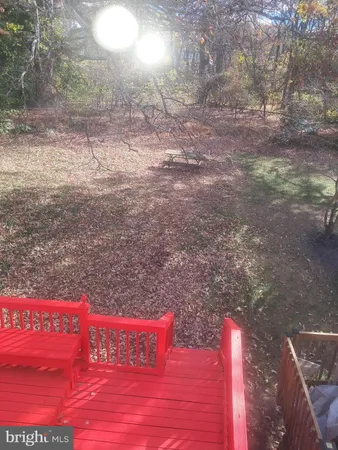 a view of outdoor space with wooden floor