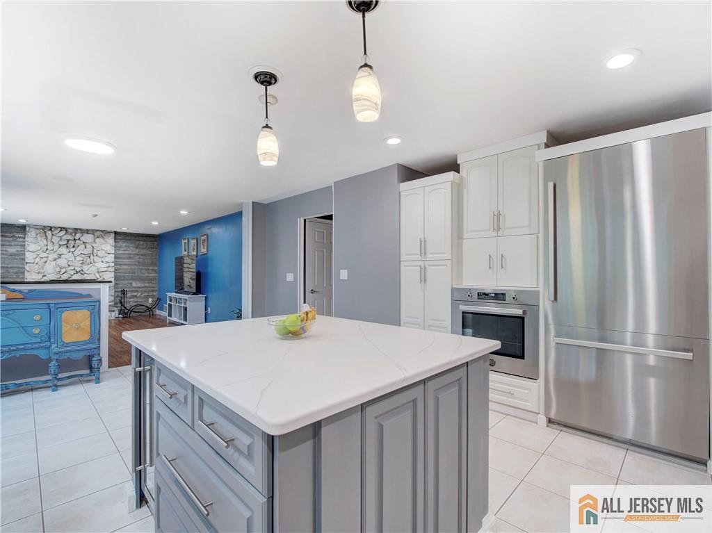 4 Cherokee Road East Brunswick, NJ 08816 - Photo 11 of 40 a kitchen with a refrigerator a oven and a sink