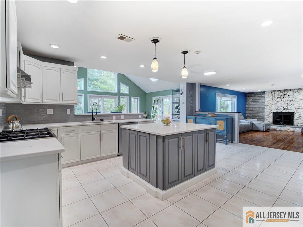 4 Cherokee Road East Brunswick, NJ 08816 - Photo 12 of 40 a kitchen with a sink a counter top space and cabinets