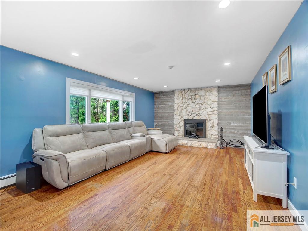 4 Cherokee Road East Brunswick, NJ 08816 - Photo 17 of 40 a living room with furniture and a flat screen tv