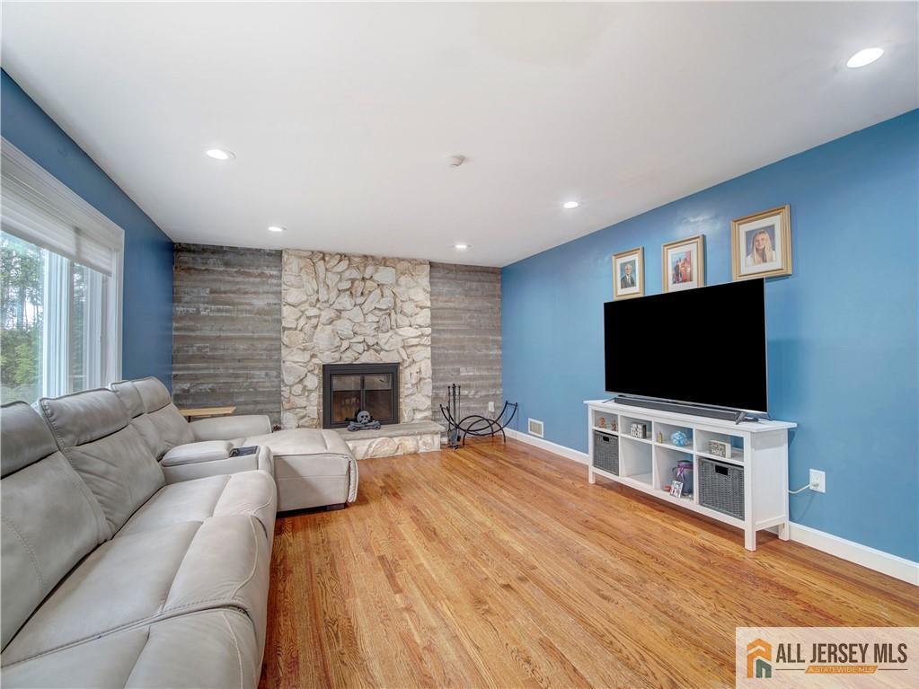 4 Cherokee Road East Brunswick, NJ 08816 - Photo 18 of 40 a living room with furniture and a flat screen tv