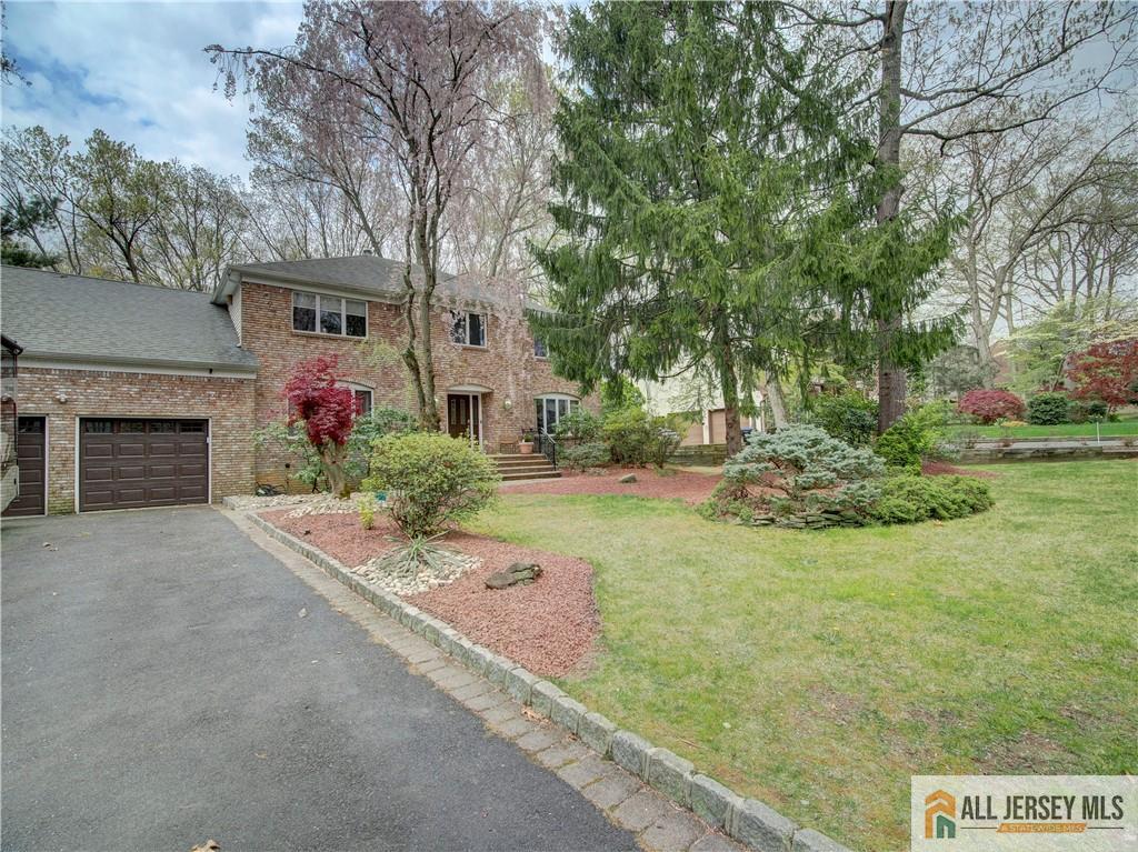 4 Cherokee Road East Brunswick, NJ 08816 - Photo 2 of 40 a front view of a house with garden