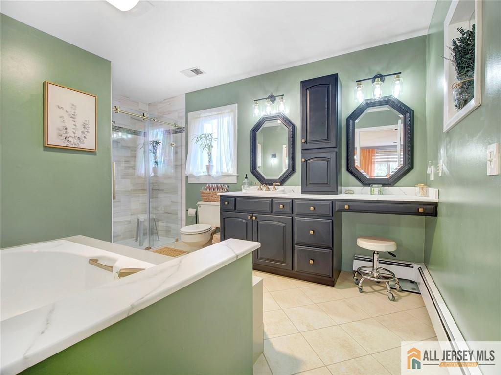 4 Cherokee Road East Brunswick, NJ 08816 - Photo 27 of 40 a bathroom with a sink mirror and vanity