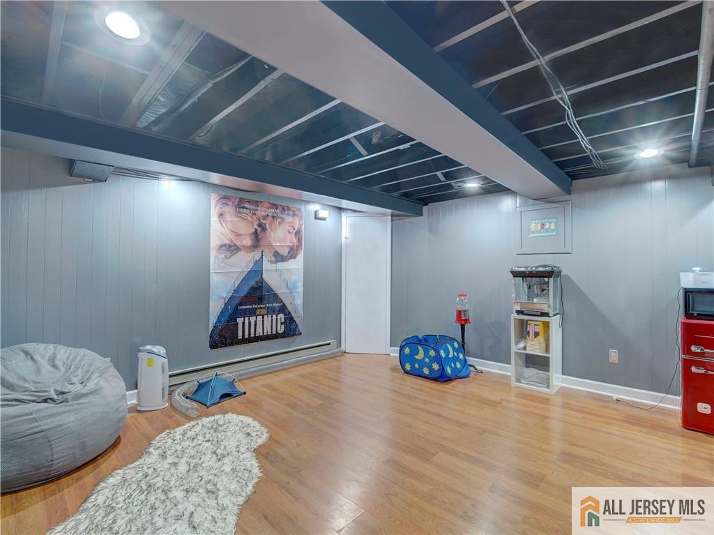 4 Cherokee Road East Brunswick, NJ 08816 - Photo 30 of 40 a bedroom with furniture and wooden floor