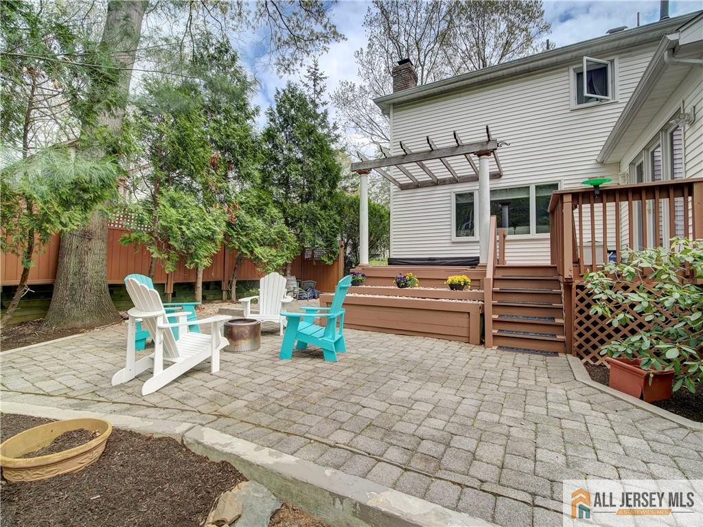 4 Cherokee Road East Brunswick, NJ 08816 - Photo 38 of 40 a view of a chairs and table in backyard of the house