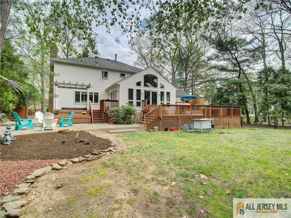 4 Cherokee Road East Brunswick, NJ 08816 - Photo 39 of 40 a front view of a house with a yard and trees